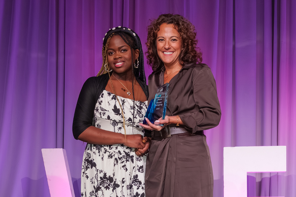 Naomi Tamajong recieving the 2025 Dottie Lamm Leadership Award at WFCO's 2025 Annual Luncheon.