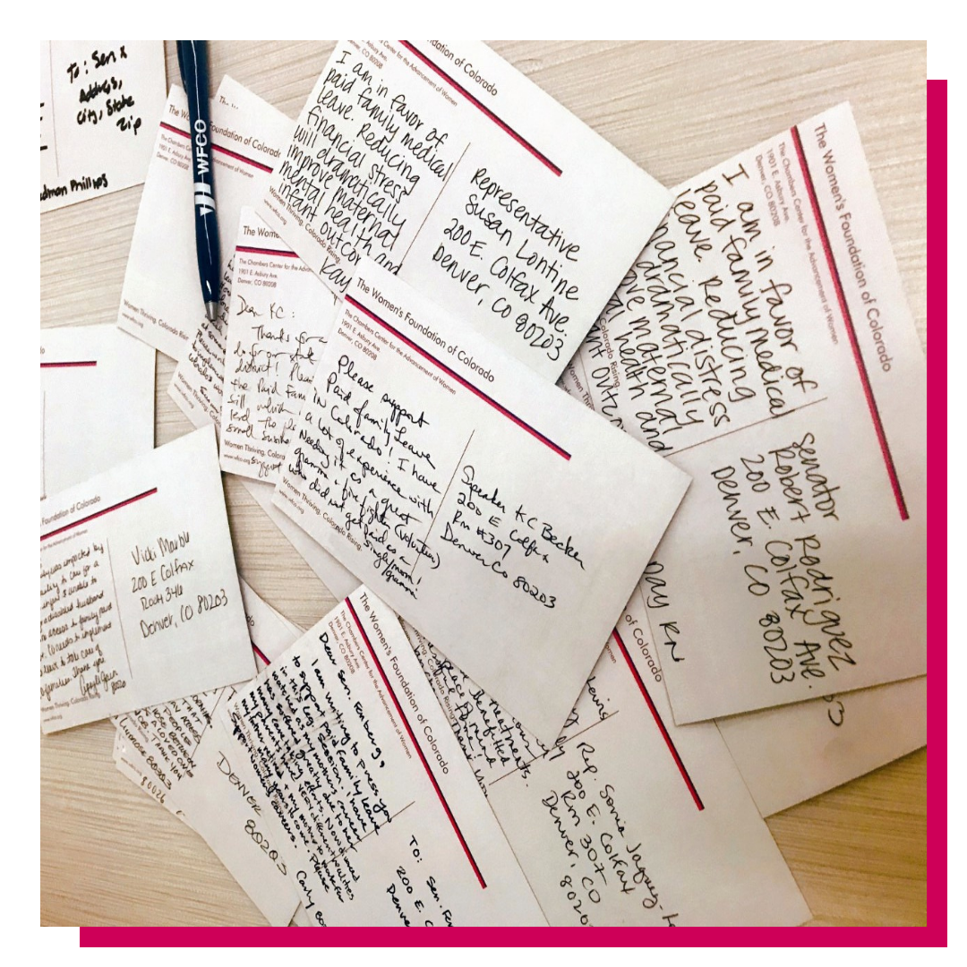 An assortment of postcards written to legislators lay on a table after an Advocating for Impact training