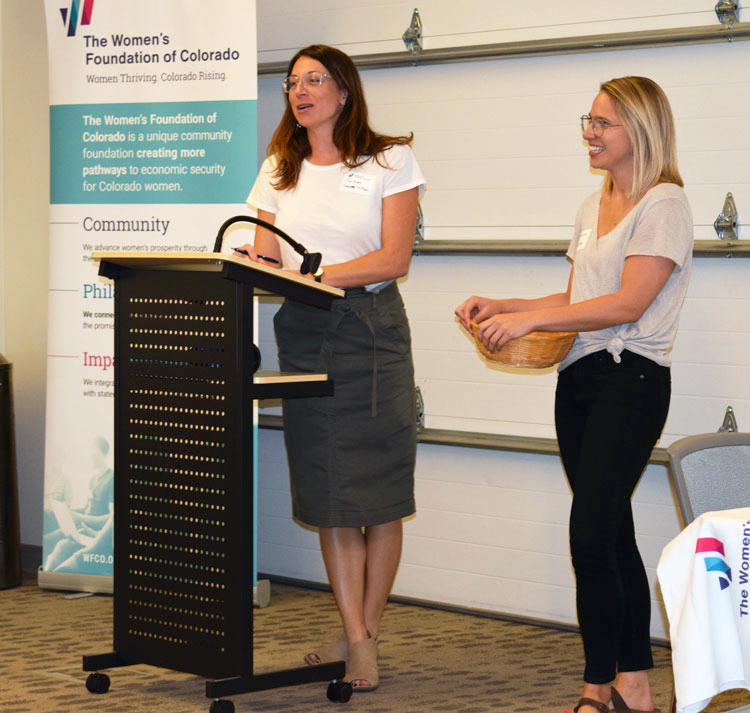 Northern Colorado committee co-chairs standing at podium during event